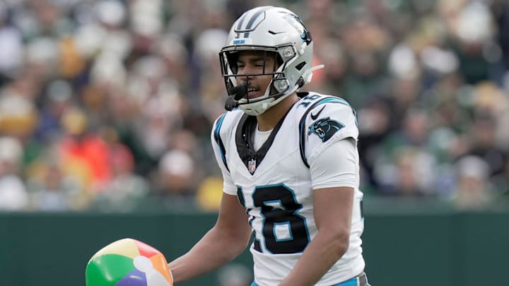 Carolina Panthers wide receiver Jalen Coker (18) grabs a beach ball; that blew onto the field during the second quarter of their game against the Green Bay Packers Sunday, November 2, 2025 at Lambeau Field in Green Bay, Wisconsin.