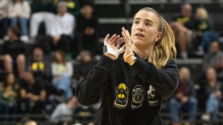 Sabrina Ionescu mimes taking a shot during her appearance on the court during the game between Oregon Ducks and Baylor at Matthew Knight Arena in Eugene. Sabrina Ionescu mimes taking a shot during her appearance on the court during the game between Oregon Ducks and Baylor at Matthew Knight Arena in Eugene.