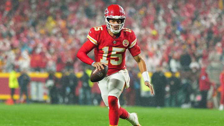 Nov 4, 2024; Kansas City, Missouri, USA; Kansas City Chiefs quarterback Patrick Mahomes (15) rolls out to pass during the second half against the Tampa Bay Buccaneers at GEHA Field at Arrowhead Stadium. Mandatory Credit: Jay Biggerstaff-Imagn Images
