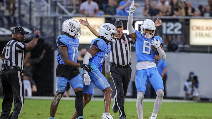 Nov 11, 2023; Orlando, Florida, USA; UCF Knights defensive back Demari Henderson (8) celebrates intercepting an Oklahoma State Cowboys pass during the second quarter at FBC Mortgage Stadium. Mandatory Credit: Mike Watters-USA TODAY Sports
