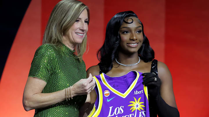 Apr 13, 2026; New York, NY, USA;  WNBA Commissioner Cathy Engelbert (left) poses for photos with Ta'Niya Latson who was selected twentieth overall by the Los Angeles Sparks during the 2026 WNBA Draft at The Shed at Hudson Yards. Mandatory Credit: Brad Penner-Imagn Images