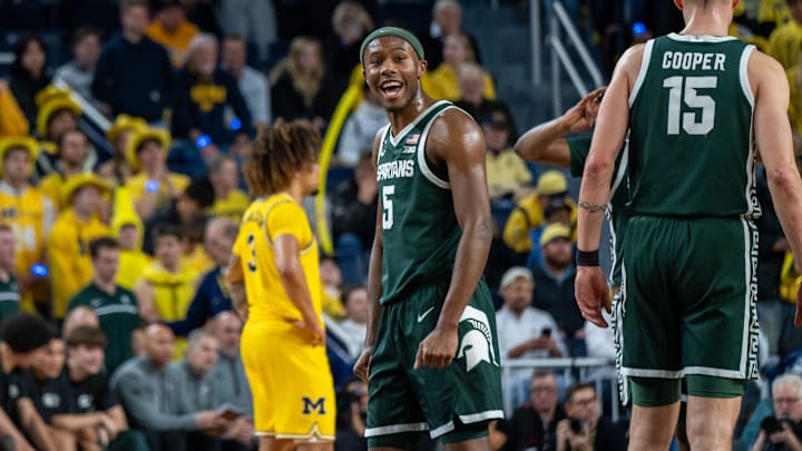 Michigan State’s Tre Holloman celebrates after the Spartans beat Michigan 75-62 in their rivalry matchup at Crisler Center in Ann Arbor on Friday, Feb. 21, 2025.