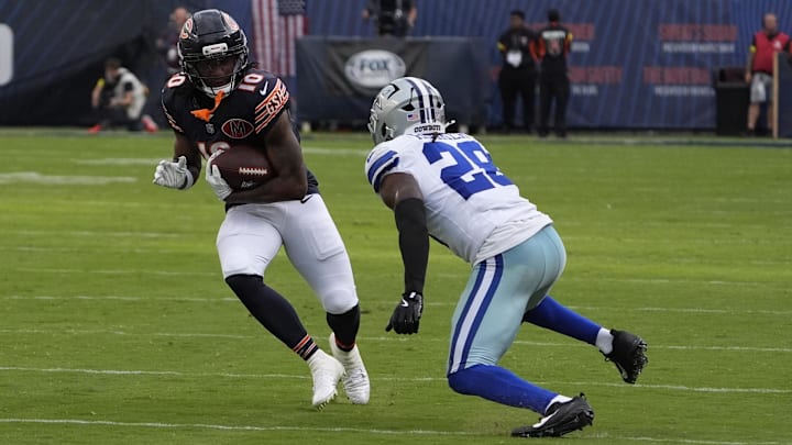 Luther Burden III looks for catch-and-run action against Dallas safety Malik Hooker in the Bears' Week 3 win. Luther Burden III looks for catch-and-run action against Dallas safety Malik Hooker in the Bears' Week 3 win.