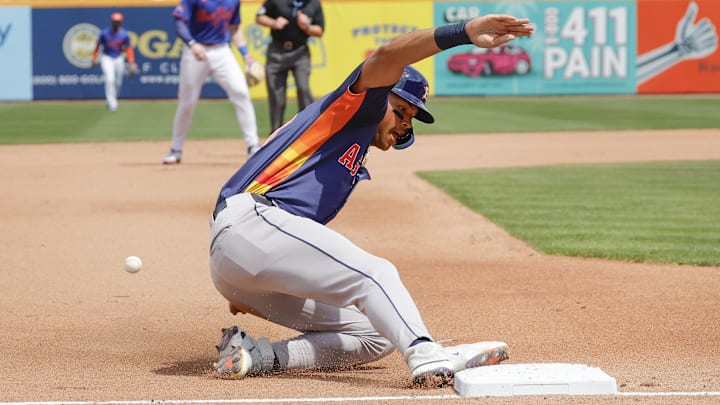 Mar 16, 2025; Port St. Lucie, Florida, USA;  Houston Astros outfielder Cam Smith slides safely into third base during the fourth inning against the New York Mets at Clover Park. Mandatory Credit: Reinhold Matay-Imagn Images