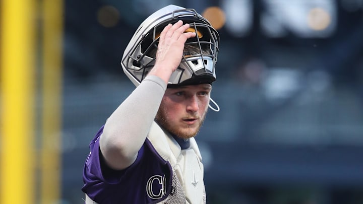 Colorado Rockies catcher Hunter Goodman (15) looks to the Rockies dugout.