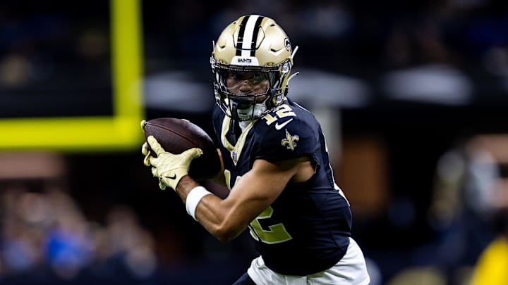 Dec 3, 2023; New Orleans, Louisiana, USA; New Orleans Saints wide receiver Chris Olave (12) catches a pass against the Detroit Lions during the first half at the Caesars Superdome. Mandatory Credit: Stephen Lew-Imagn Images