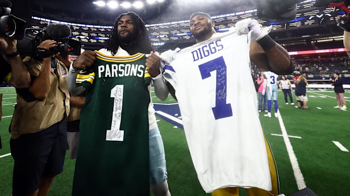 Green Bay Packers defensive end Micah Parsons and Dallas Cowboys cornerback Trevon Diggs exchange jerseys