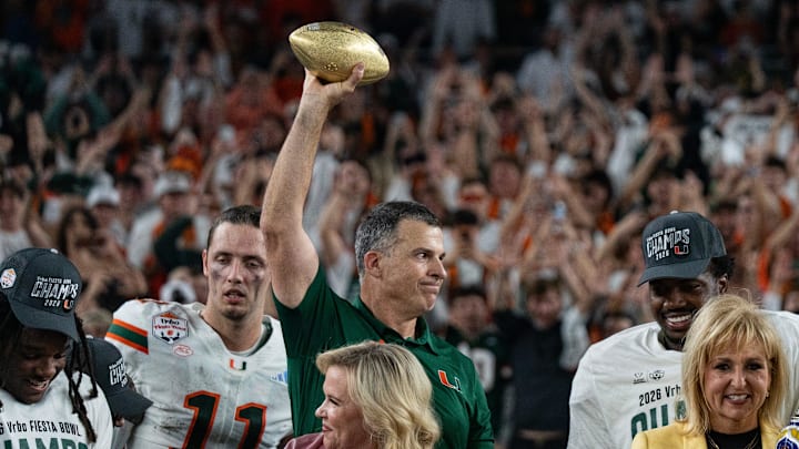 Miami Hurricanes head coach Mario Cristobal holds up the trophy after winning the CFP Fiesta Bowl against Ole Miss at the State Farm Stadium, in Glendale, Ariz., on Thursday, Jan. 8, 2026. Miami Hurricanes head coach Mario Cristobal holds up the trophy after winning the CFP Fiesta Bowl against Ole Miss at the State Farm Stadium, in Glendale, Ariz., on Thursday, Jan. 8, 2026.