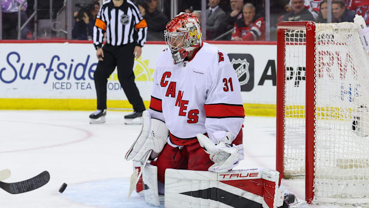 Apr 25, 2025; Newark, New Jersey, USA; Carolina Hurricanes goaltender Frederik Andersen (31) makes a save against the New Jersey Devils during the first overtime in game three of the first round of the 2025 Stanley Cup Playoffs at Prudential Center. Mandatory Credit: Ed Mulholland-Imagn Images