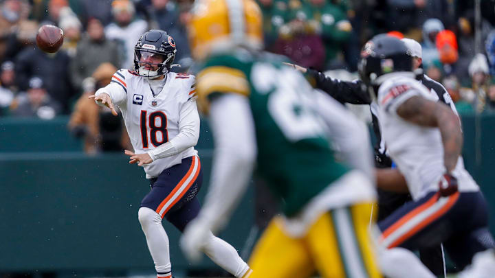 Quarterback Caleb Williams throws on the run against the Green Bay defense last year in a 24-22 Bears win at Lambeau Field.