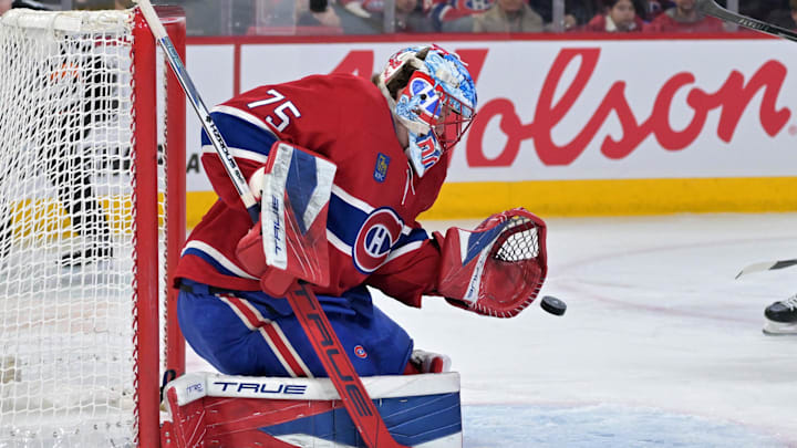 Apr 7, 2026; Montreal, Quebec, CAN; Montreal Canadiens goalie Jakub Dobes (75) makes a save during the first period of the game against the Florida Panthers at the Bell Centre. Mandatory Credit: Eric Bolte-Imagn Images