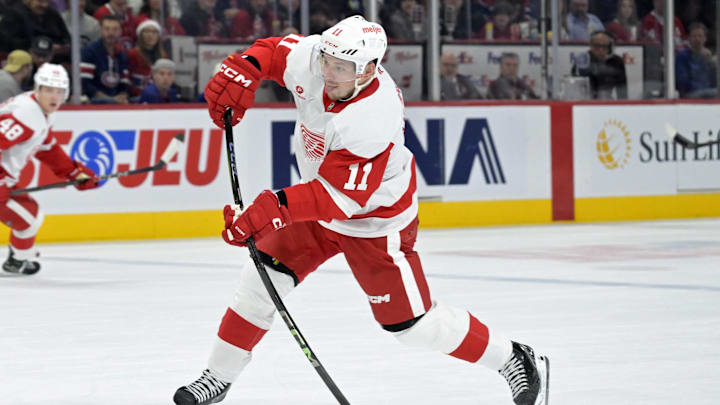 Dec 21, 2024; Montreal, Quebec, CAN; Detroit Red Wings forward Vladimir Tarasenko (11) takes a shot on net during the first period of the game against the Montreal Canadiens at the Bell Centre. Mandatory Credit: Eric Bolte-Imagn Images