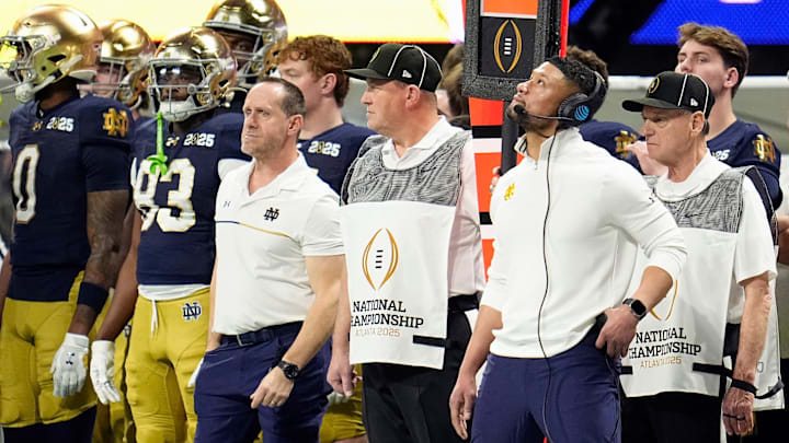 Notre Dame Fighting Irish head coach Marcus Freeman watches a replay against Ohio State.