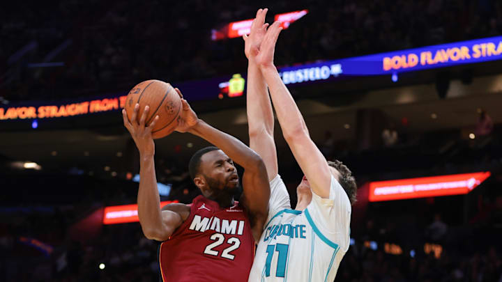 Nov 7, 2025; Miami, Florida, USA; Miami Heat forward Andrew Wiggins (22) drives to the basket against Charlotte Hornets center Ryan Kalkbrenner (11) during the fourth quarter of an NBA Cup game at Kaseya Center. Mandatory Credit: Sam Navarro-Imagn Images