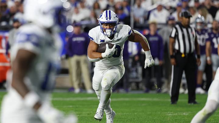 Sep 21, 2024; Provo, Utah, USA; Brigham Young Cougars running back Sione I Moa (30) runs the ball for a touchdown against the Kansas State Wildcats during the fourth quarter at LaVell Edwards Stadium. Mandatory Credit: Rob Gray-Imagn Images