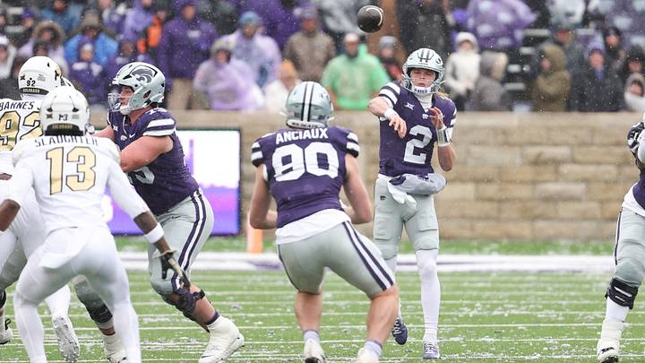Nov 29, 2025; Manhattan, Kansas, USA; Kansas State Wildcats quarterback Avery Johnson (2) passes the ball to tight end Will Anciaux (80) during the first quarter against the Colorado Buffaloes at Bill Snyder Family Football Stadium. Mandatory Credit: Scott Sewell-Imagn Images Nov 29, 2025; Manhattan, Kansas, USA; Kansas State Wildcats quarterback Avery Johnson (2) passes the ball to tight end Will Anciaux (80) during the first quarter against the Colorado Buffaloes at Bill Snyder Family Football Stadium. Mandatory Credit: Scott Sewell-Imagn Images