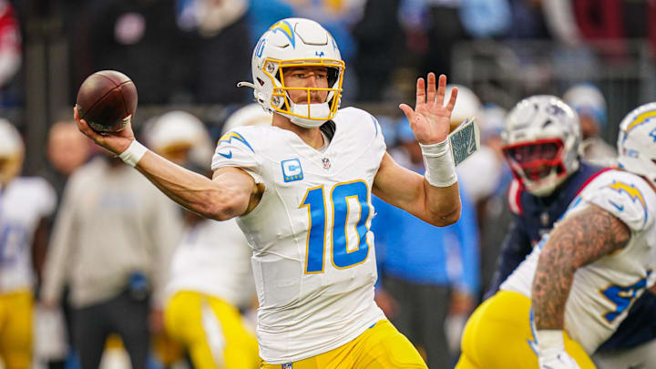 Dec 28, 2024; Foxborough, Massachusetts, USA; Los Angeles Chargers quarterback Justin Herbert (10) passes the ball against the New England Patriots in the third quarter at Gillette Stadium. Mandatory Credit: David Butler II-Imagn Images