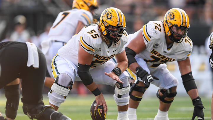 Missouri Tigers offensive lineman Connor Tollison (55) snaps the ball, in a game against the Vanderbilt Commodores last season.