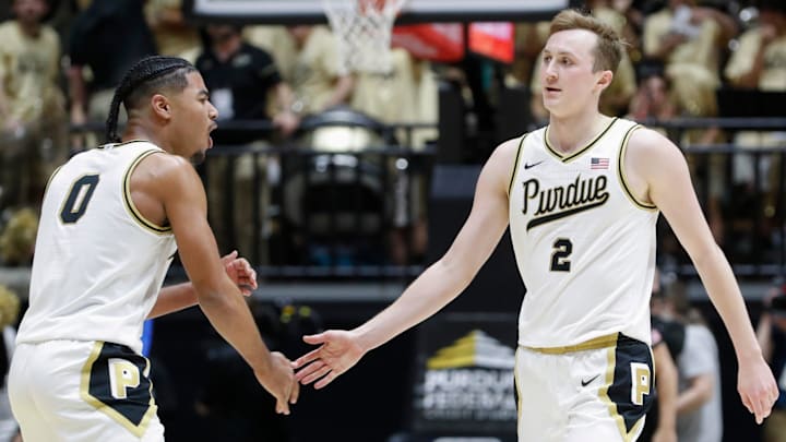 Purdue Boilermakers guard C.J. Cox (0) high-fives Purdue Boilermakers guard Fletcher Loyer (2) 
