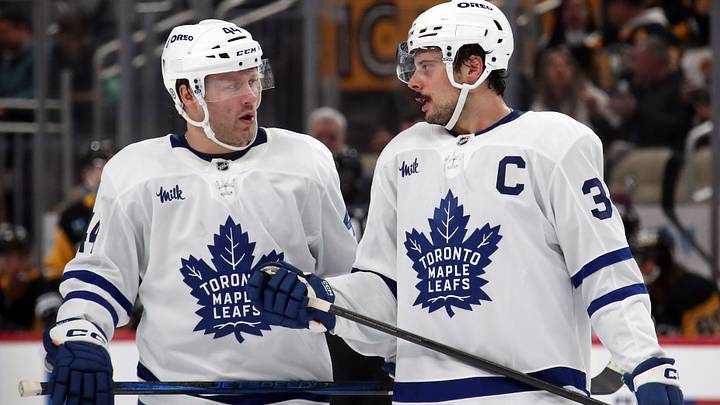 Dec 7, 2024; Pittsburgh, Pennsylvania, USA; Toronto Maple Leafs defenseman Morgan Rielly (44) and center Auston Matthews (34) talk before a face-off against the Pittsburgh Penguins during the second period at PPG Paints Arena. Mandatory Credit: Charles LeClaire-Imagn Images Dec 7, 2024; Pittsburgh, Pennsylvania, USA; Toronto Maple Leafs defenseman Morgan Rielly (44) and center Auston Matthews (34) talk before a face-off against the Pittsburgh Penguins during the second period at PPG Paints Arena. Mandatory Credit: Charles LeClaire-Imagn Images