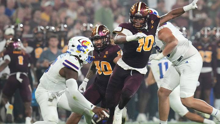 Arizona State defensive lineman Clayton Smith (10) closes in for a sack on Kansas quarterback Jalon Daniels (6) at Mountain America Stadium on Oct. 5, 2024. Arizona State defensive lineman Clayton Smith (10) closes in for a sack on Kansas quarterback Jalon Daniels (6) at Mountain America Stadium on Oct. 5, 2024.