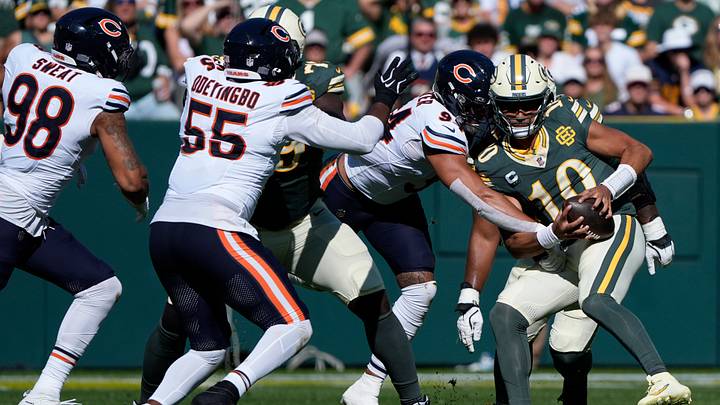 Oct 11, 2026; Green Bay, Wisconsin, USA;  Green Bay Packers quarterback Jordan Love (10) is sacked by Chicago Bears defensive end Austin Booker (94) at the end of the second quarter at Lambeau Field.  Mandatory Credit: Dan Powers USAToday Network via IMAGN images