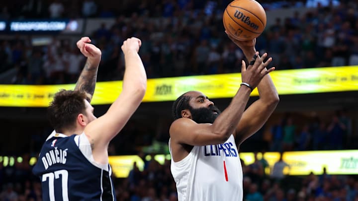 Apr 28, 2024; Dallas, Texas, USA;  LA Clippers guard James Harden (1) shoots past Dallas Mavericks
