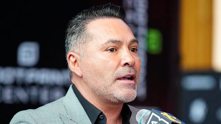Oscar De La Hoya speaks about boxer Jamie Munguia (center) about the Munguia v Ryder main event during a press conference for Golden Boy boxing event on Jan. 25, 2024.