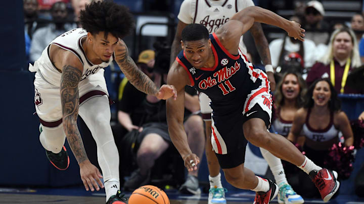 Mar 14, 2024; Nashville, TN, USA; Texas A&M Aggies forward Andersson Garcia (left) and Mississippi Rebels guard Matthew Murrell (11) work for a loose ball during the first half at Bridgestone Arena. Mandatory Credit: Christopher Hanewinckel-Imagn Images Mar 14, 2024; Nashville, TN, USA; Texas A&M Aggies forward Andersson Garcia (left) and Mississippi Rebels guard Matthew Murrell (11) work for a loose ball during the first half at Bridgestone Arena. Mandatory Credit: Christopher Hanewinckel-Imagn Images