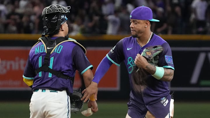 Sep 5, 2025; Phoenix, Arizona, USA; Arizona Diamondbacks catcher Gabriel Moreno (14) and second base Ketel Marte (4) celebrate after defeating the Boston Red Sox at Chase Field. Mandatory Credit: Rick Scuteri-Imagn Images