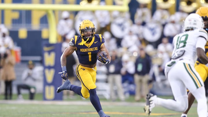Nov 16, 2024; Morgantown, West Virginia, USA; West Virginia Mountaineers running back Jahiem White (1) runs the ball during the first quarter against the Baylor Bears at Mountaineer Field at Milan Puskar Stadium. Mandatory Credit: Ben Queen-Imagn Images