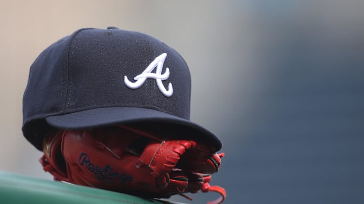 Jun 4, 2019; Pittsburgh, PA, USA; An Atlanta Braves hat and glove sit on the dugout rail before the game against the Pittsburgh Pirates at PNC Park. Atlanta won 12-5. Mandatory Credit: Charles LeClaire-Imagn Images Jun 4, 2019; Pittsburgh, PA, USA; An Atlanta Braves hat and glove sit on the dugout rail before the game against the Pittsburgh Pirates at PNC Park. Atlanta won 12-5. Mandatory Credit: Charles LeClaire-Imagn Images