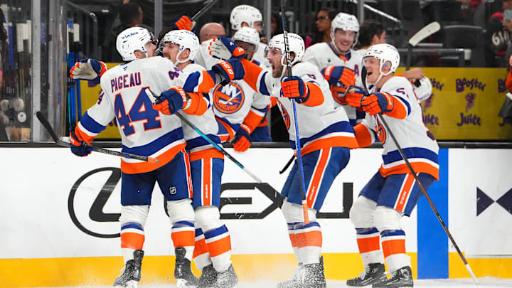 Nov 13, 2025; Las Vegas, Nevada, USA; New York Islanders center Jean-Gabriel Pageau (44) celebrates with team mates after scoring a short-handed goal against the Vegas Golden Knights during an overtime period to give the Islanders a 4-3 victory at T-Mobile Arena. Mandatory Credit: Stephen R. Sylvanie-Imagn Images Nov 13, 2025; Las Vegas, Nevada, USA; New York Islanders center Jean-Gabriel Pageau (44) celebrates with team mates after scoring a short-handed goal against the Vegas Golden Knights during an overtime period to give the Islanders a 4-3 victory at T-Mobile Arena. Mandatory Credit: Stephen R. Sylvanie-Imagn Images