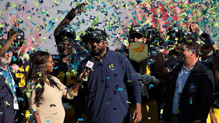 Dec 31, 2024; Tampa, FL, USA; Michigan Wolverines head coach Sherrone Moore celebrates after beating the Alabama Crimson Tide in the ReliaQuest Bowl at Raymond James Stadium. Mandatory Credit: Nathan Ray Seebeck-Imagn Images Dec 31, 2024; Tampa, FL, USA; Michigan Wolverines head coach Sherrone Moore celebrates after beating the Alabama Crimson Tide in the ReliaQuest Bowl at Raymond James Stadium. Mandatory Credit: Nathan Ray Seebeck-Imagn Images