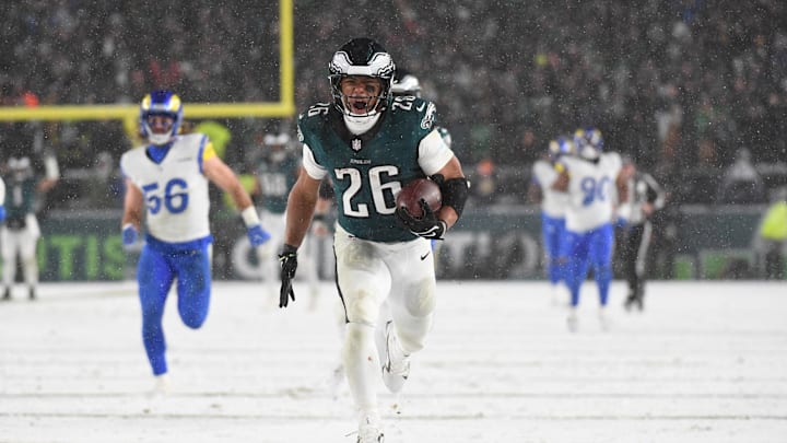 Jan 19, 2025; Philadelphia, Pennsylvania, USA; Philadelphia Eagles running back Saquon Barkley (26) carries the ball to score a touchdown against the Los Angeles Rams in the second half in a 2025 NFC divisional round game at Lincoln Financial Field. Mandatory Credit: Eric Hartline-Imagn Images