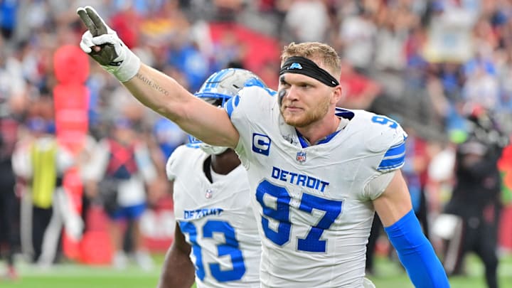 Detroit Lions defensive end Aidan Hutchinson celebrates after stopping the Arizona Cardinals on 4th and 1.