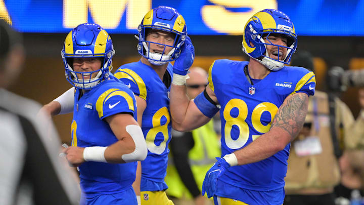Jan 4, 2026; Inglewood, California, USA;  Los Angeles Rams tight end Tyler Higbee (89) reacts with quarterback Matthew Stafford (9) after scoring a touchdown against the Arizona Cardinals during the second half at SoFi Stadium. Mandatory Credit: Jayne Kamin-Oncea-Imagn Images