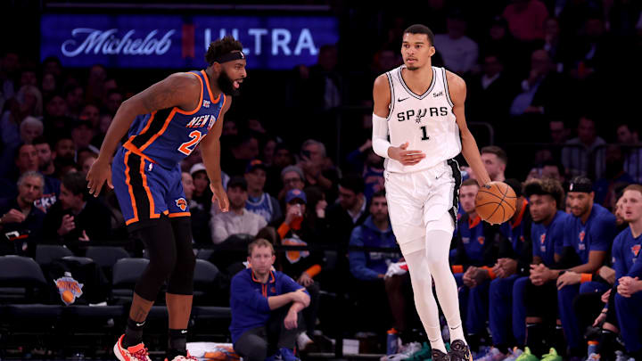 Nov 8, 2023; New York, New York, USA; San Antonio Spurs center Victor Wembanyama (1) controls the ball against New York Knicks center Mitchell Robinson (23) during the third quarter at Madison Square Garden. Mandatory Credit: Brad Penner-Imagn Images