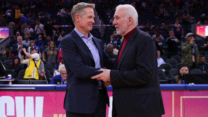 Nov 1, 2019; San Francisco, CA, USA; Golden State Warriors head coach Steve Kerr and San Antonio Spurs head coach Gregg Popovich meet after the game at the Chase Center. Mandatory Credit: Cary Edmondson-Imagn Images