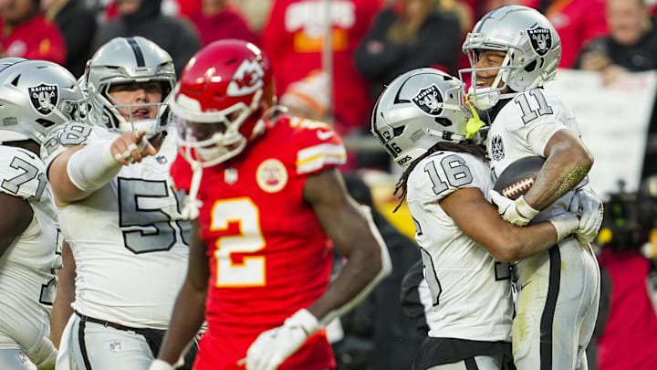 Nov 29, 2024; Kansas City, Missouri, USA; Las Vegas Raiders wide receiver Tre Tucker (11) celebrates with wide receiver Jakobi Meyers (16) after scoring a touchdown during the second half against the Kansas City Chiefs at GEHA Field at Arrowhead Stadium. Mandatory Credit: Jay Biggerstaff-Imagn Images