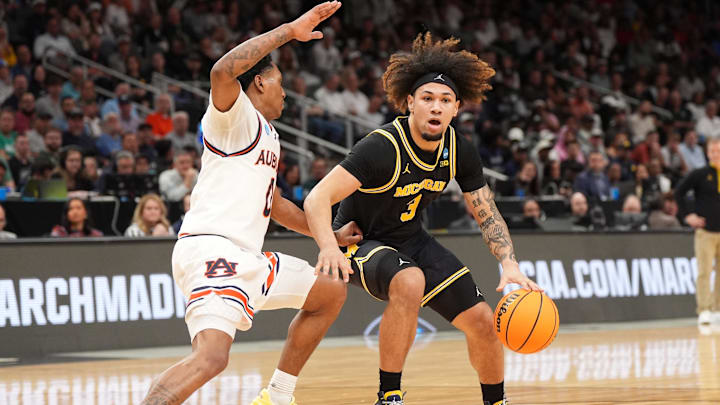 Mar 28, 2025; Atlanta, GA, USA; Michigan Wolverines guard Tre Donaldson (3) dribbles against Auburn Tigers guard Tahaad Pettiford (0) in the first half of a South Regional semifinal of the 2025 NCAA tournament at State Farm Arena. Mandatory Credit: Dale Zanine-Imagn Images Mar 28, 2025; Atlanta, GA, USA; Michigan Wolverines guard Tre Donaldson (3) dribbles against Auburn Tigers guard Tahaad Pettiford (0) in the first half of a South Regional semifinal of the 2025 NCAA tournament at State Farm Arena. Mandatory Credit: Dale Zanine-Imagn Images