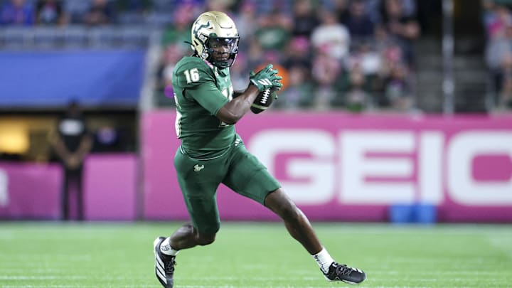 Dec 17, 2025; Orlando, FL, USA; South Florida Bulls wide receiver Jeremiah Koger (16) receives a pass against the Old Dominion Monarchs in the second quarter during the Cure Bowl at Camping World Stadium. Mandatory Credit: Nathan Ray Seebeck-Imagn Images