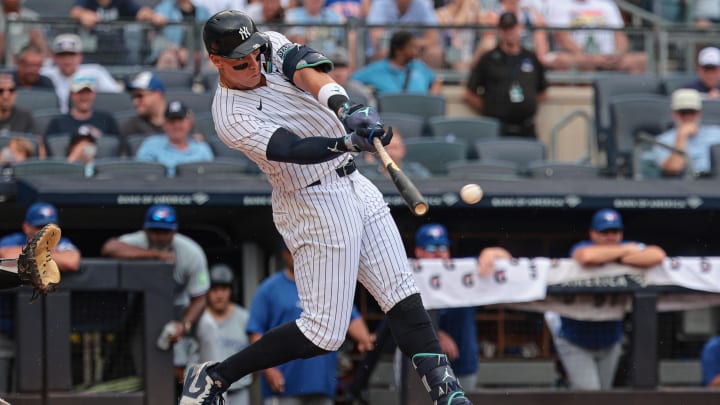 Aug 4, 2024; Bronx, New York, USA; New York Yankees left fielder Aaron Judge (99) singles during the third inning against the Toronto Blue Jays at Yankee Stadium. Mandatory Credit: Vincent Carchietta-USA TODAY Sports Aug 4, 2024; Bronx, New York, USA; New York Yankees left fielder Aaron Judge (99) singles during the third inning against the Toronto Blue Jays at Yankee Stadium. Mandatory Credit: Vincent Carchietta-USA TODAY Sports