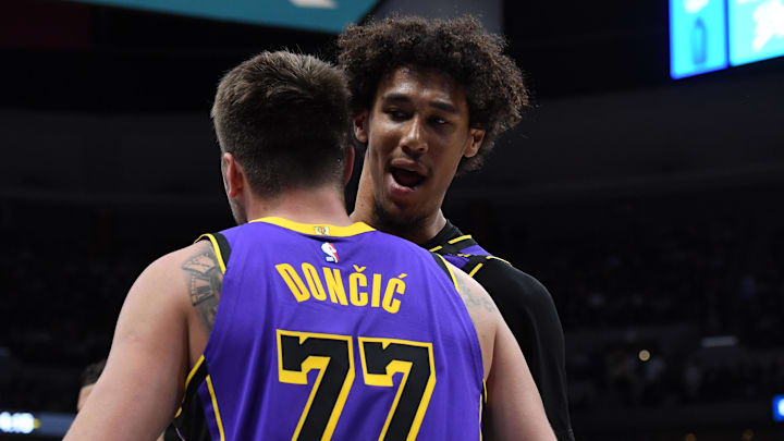 Feb 22, 2025; Denver, Colorado, USA; Los Angeles Lakers guard Luka Doncic (77) is congratulated by center Jaxson Hayes (11) after making a basket during the second half against the Denver Nuggets at Ball Arena. Mandatory Credit: Christopher Hanewinckel-Imagn Images