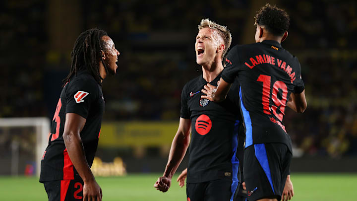 Dani Olmo (centre) broke the deadlock for Barcelona at Las Palmas