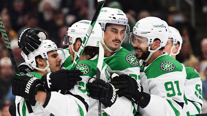 Oct 24, 2024; Boston, Massachusetts, USA;  Dallas Stars center Logan Stankoven (11) is mobbed by his teammates after scoring a goal during the second period against the Boston Bruins at TD Garden. Mandatory Credit: Bob DeChiara-Imagn Images