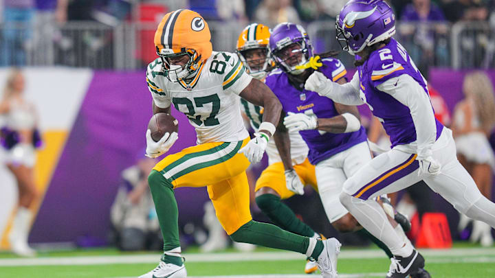 Dec 29, 2024; Minneapolis, Minnesota, USA; Green Bay Packers wide receiver Romeo Doubs (87) runs after the catch against Minnesota Vikings in the fourth quarter at U.S. Bank Stadium. Mandatory Credit: Brad Rempel-Imagn Images