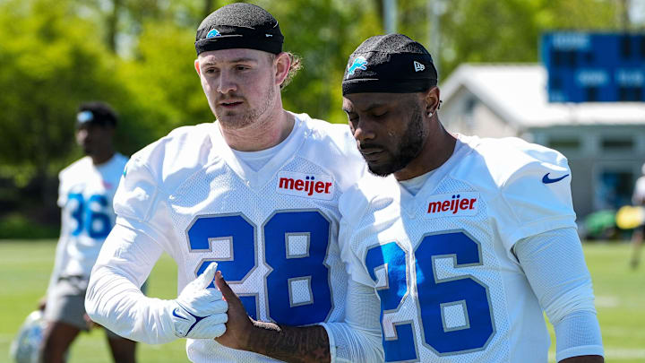 Detroit Lions safety Dan Jackson (28), left, shakes hands with former cornerback Duke Shelley (26) after practice during rookie mini camp at Meijer Performance Center in Allen Park on Friday, May 9, 2025.