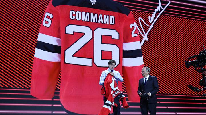 Alexander Command reacts beside NHL commissioner Gary Bettman after being selected with the twelfth pick in the first round of the 2026 NHL Draft by the New Jersey Devils at KeyBank Center. Mandatory Credit: Timothy T. Ludwig-Imagn Images Alexander Command reacts beside NHL commissioner Gary Bettman after being selected with the twelfth pick in the first round of the 2026 NHL Draft by the New Jersey Devils at KeyBank Center. Mandatory Credit: Timothy T. Ludwig-Imagn Images