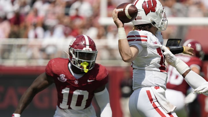 Sep 13, 2025; Tuscaloosa, Alabama, USA;  Alabama linebacker Justin Jefferson (10) and Alabama defensive lineman LT Overton (22) pressure Wisconsin quarterback Danny O'Neil (18) as he passes the ball at Saban Field at Bryant-Denny Stadium. Mandatory Credit: Gary Cosby-USA TODAY Network via Imagn Images